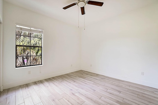 unfurnished room featuring ceiling fan and light wood-type flooring