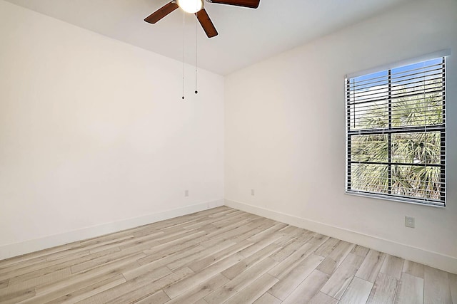 unfurnished room with ceiling fan and light wood-type flooring