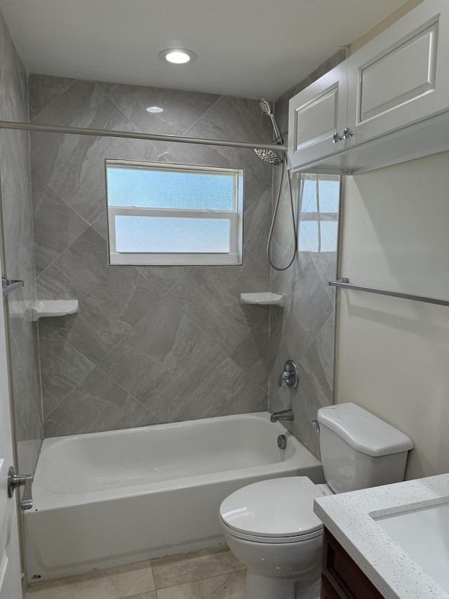 full bathroom with vanity, toilet, and tiled shower / bath