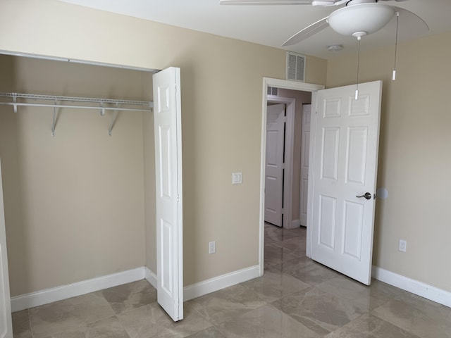 unfurnished bedroom with a closet and ceiling fan