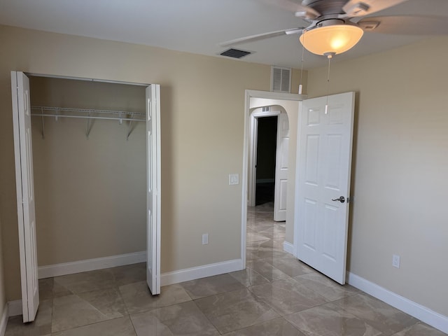 unfurnished bedroom featuring a closet and ceiling fan