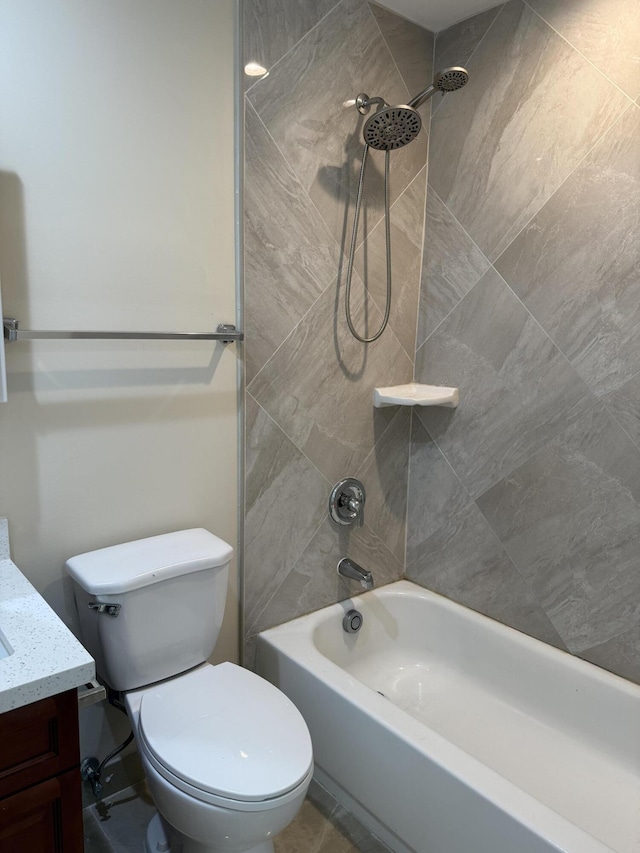 full bathroom with vanity, toilet, and tiled shower / bath