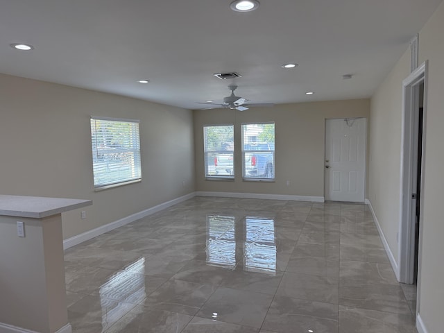 interior space featuring ceiling fan