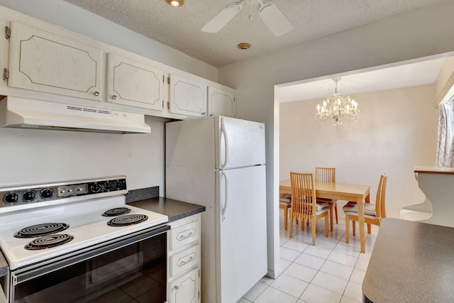 kitchen with ceiling fan with notable chandelier, white appliances, a textured ceiling, light tile patterned floors, and hanging light fixtures