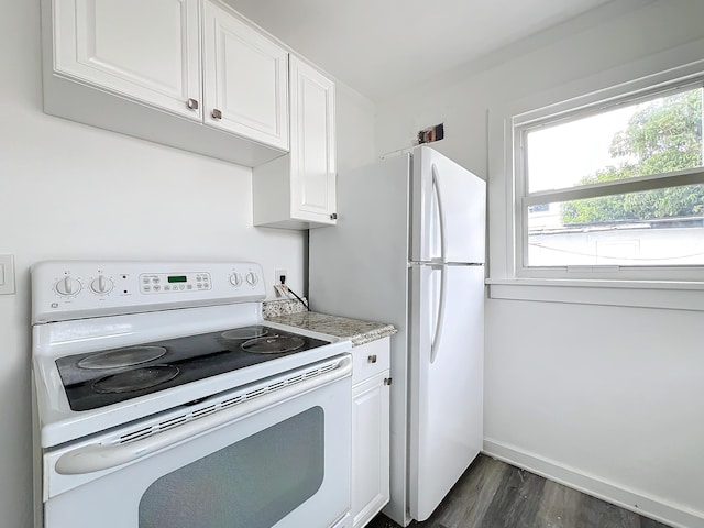 kitchen featuring white cabinets, dark hardwood / wood-style flooring, and white appliances