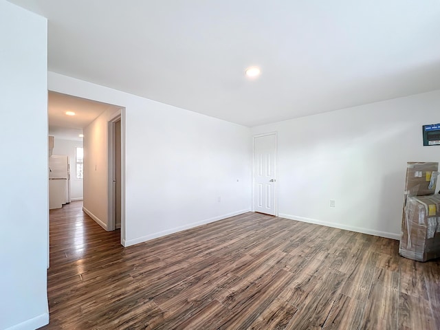 unfurnished room featuring dark hardwood / wood-style flooring