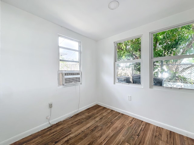 spare room featuring dark hardwood / wood-style floors