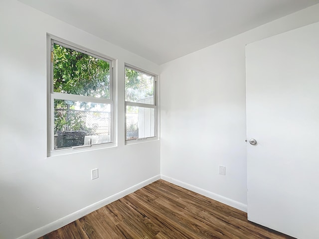 empty room featuring dark hardwood / wood-style floors