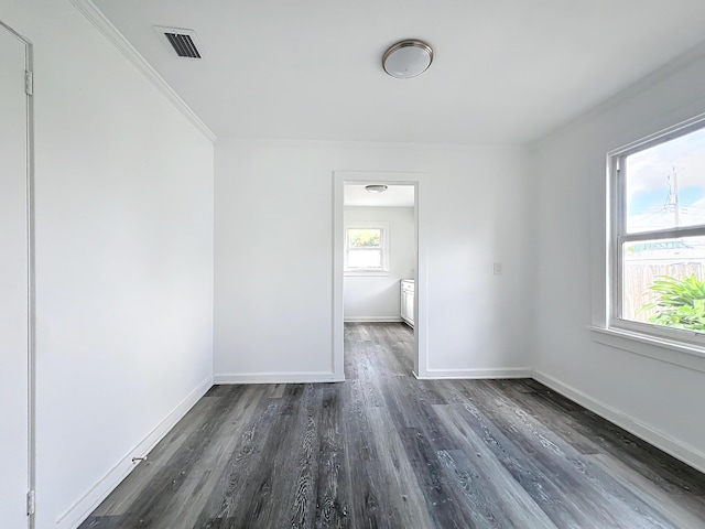 unfurnished room with dark wood-type flooring