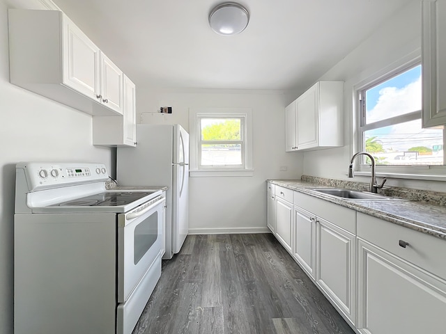 kitchen featuring white cabinets, dark hardwood / wood-style floors, white appliances, and sink