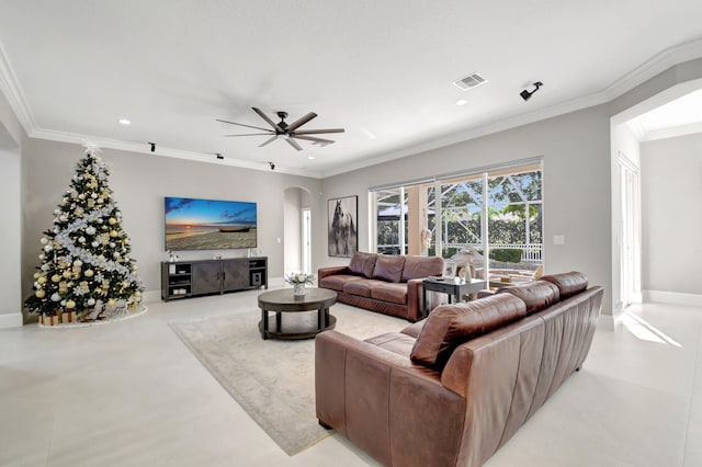 living room with ceiling fan and crown molding