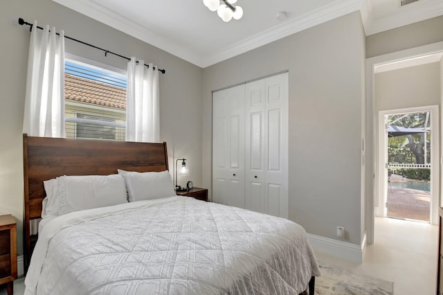 bedroom featuring ornamental molding, multiple windows, and a closet