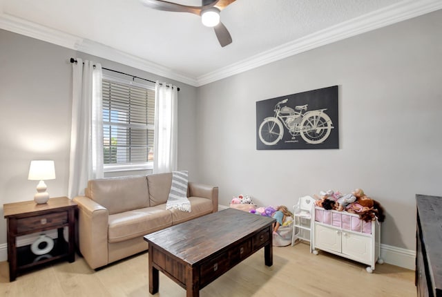 living room with ceiling fan, light hardwood / wood-style floors, and ornamental molding