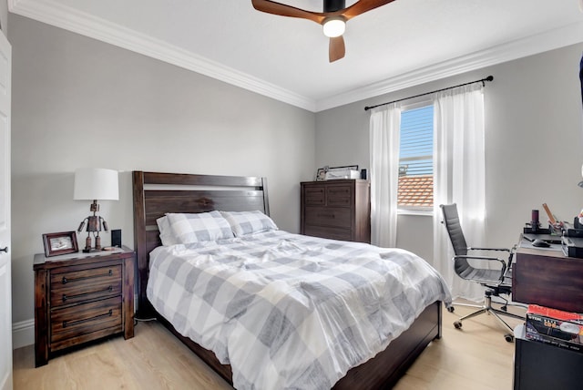 bedroom with light hardwood / wood-style floors, ceiling fan, and crown molding