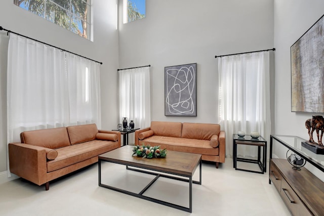 living room with a towering ceiling