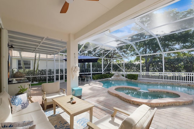 view of pool featuring an in ground hot tub, an outdoor living space, glass enclosure, and a patio area