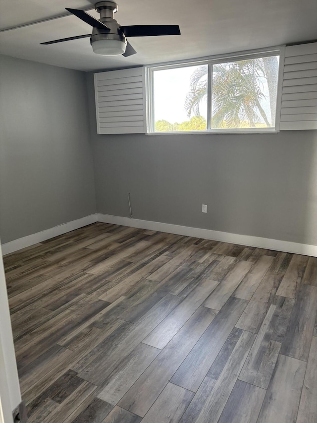 unfurnished room with ceiling fan and wood-type flooring