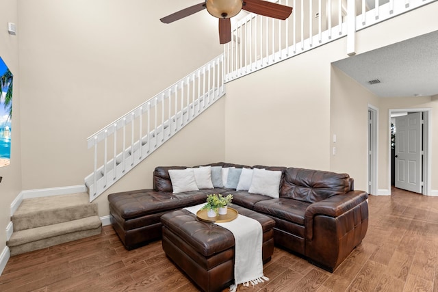 living room with ceiling fan and wood-type flooring