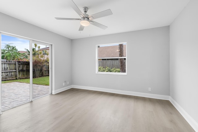 unfurnished room featuring light hardwood / wood-style flooring and ceiling fan