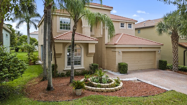 mediterranean / spanish-style house featuring a garage