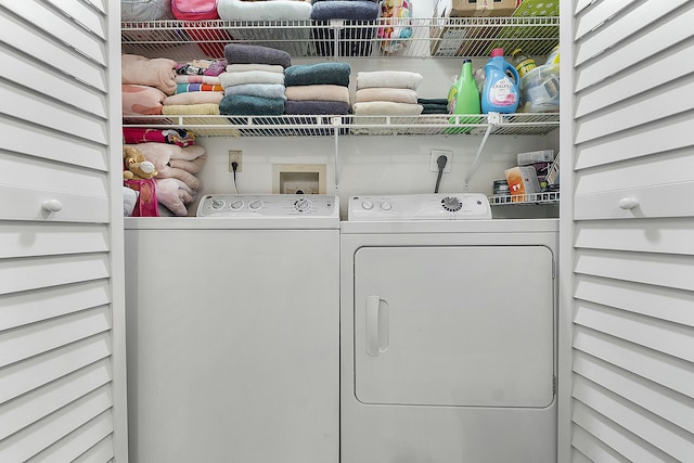 clothes washing area featuring washing machine and dryer