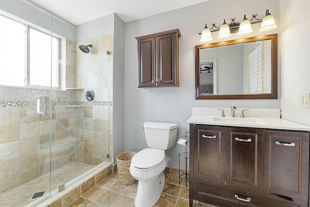 bathroom with vanity, toilet, and walk in shower