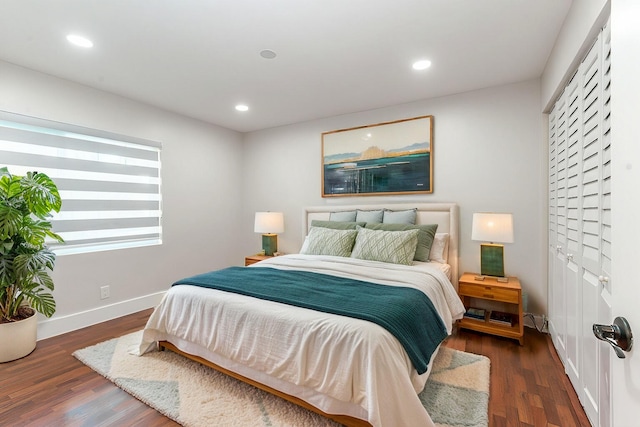 bedroom with dark hardwood / wood-style flooring and a mail area