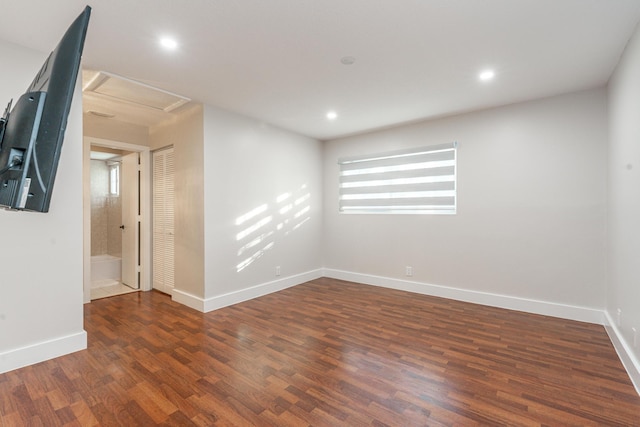 spare room featuring dark wood-type flooring