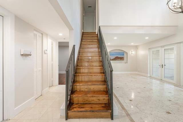 staircase with french doors