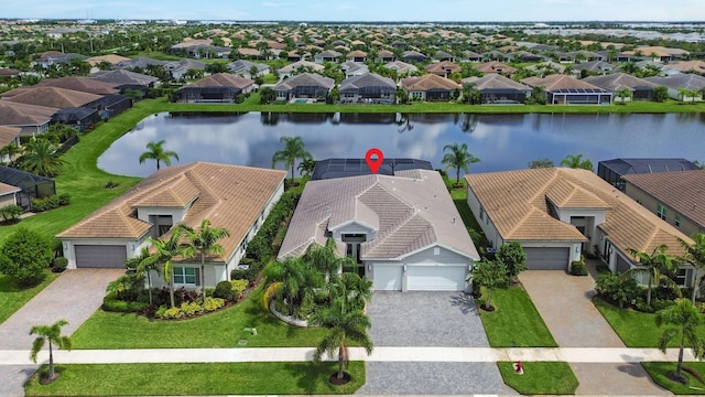 birds eye view of property featuring a water view