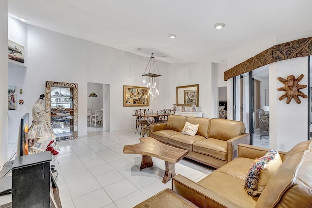 tiled living room featuring a chandelier