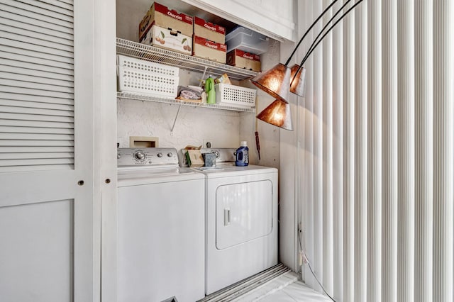 laundry room with washer and dryer