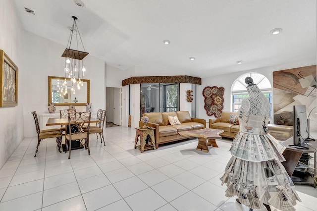 living room with a notable chandelier and light tile patterned floors