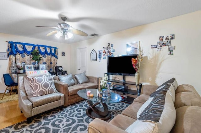 living room with hardwood / wood-style floors and ceiling fan