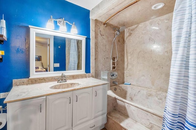 bathroom featuring shower / bath combo and vanity