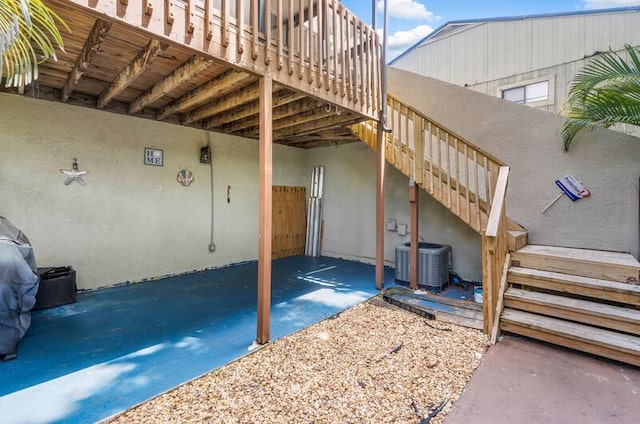 view of patio / terrace featuring a wooden deck and cooling unit