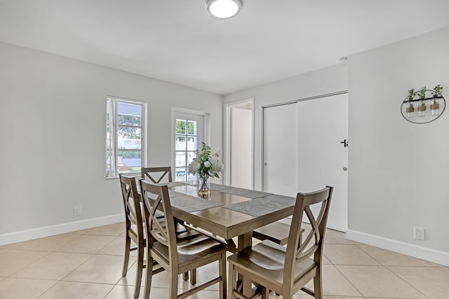 dining room featuring light tile patterned flooring