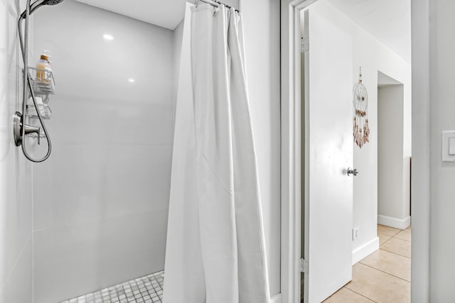 bathroom featuring tile patterned flooring and curtained shower