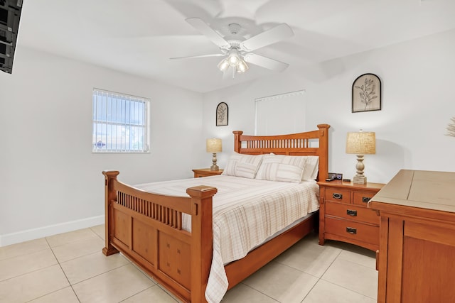 bedroom with ceiling fan and light tile patterned floors