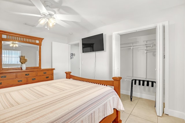 tiled bedroom with a closet and ceiling fan