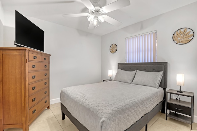 tiled bedroom with ceiling fan