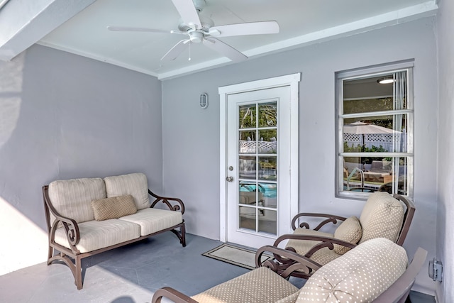 interior space with ceiling fan