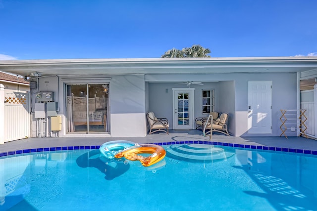 view of swimming pool with ceiling fan