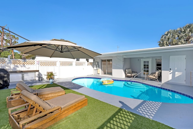 view of swimming pool with a patio area