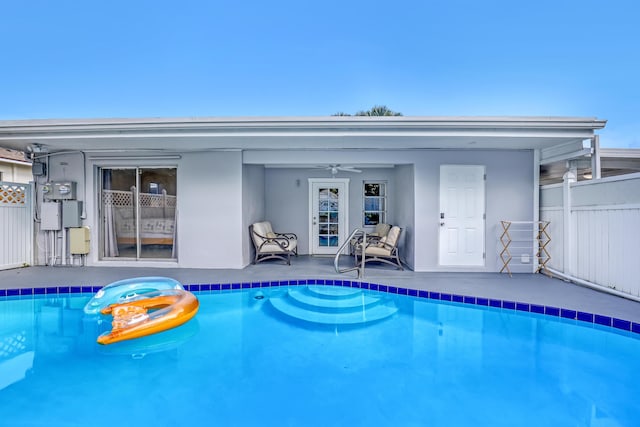 view of pool featuring ceiling fan