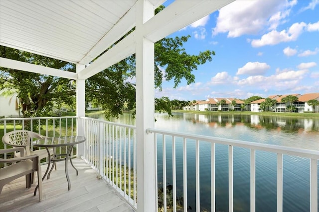 balcony featuring a water view