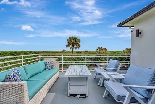 view of patio featuring outdoor lounge area and a balcony