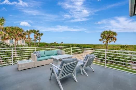 view of patio featuring an outdoor living space and a balcony