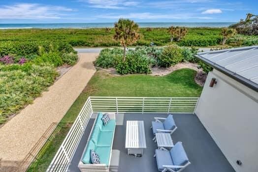 exterior space with a yard and a water view