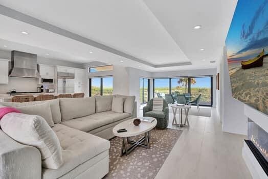 living room featuring a raised ceiling